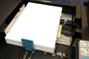 A stack of white paper placed in copier tray