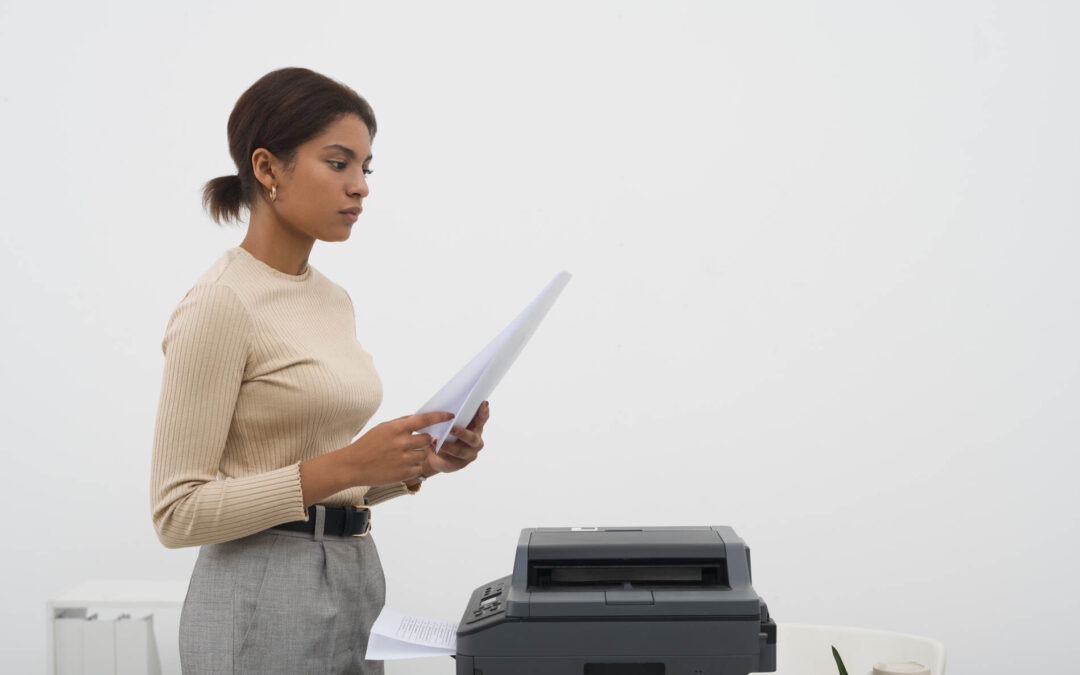 woman printing files for company report