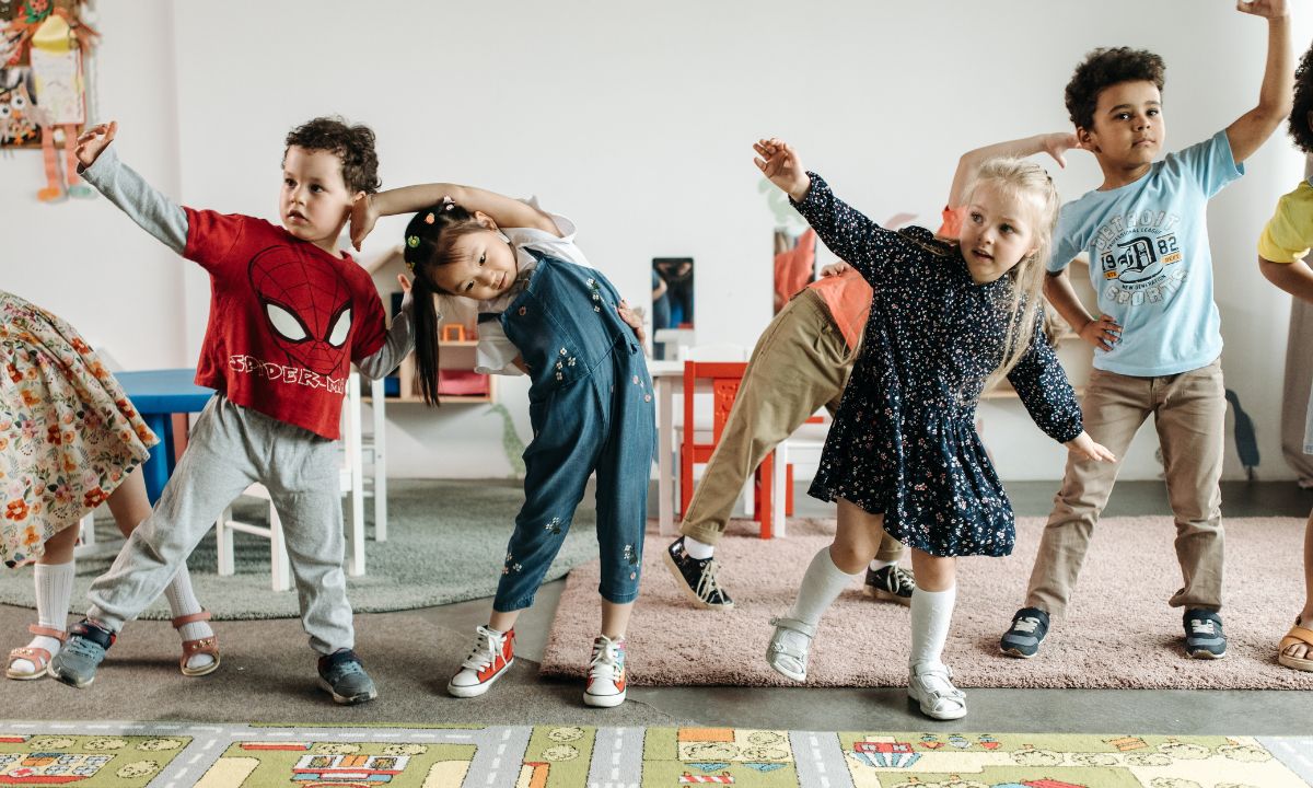 a group of school kids dancing and playing